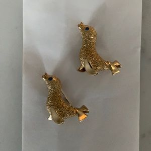 2 seal pins gold is plated (I believe) blue stone eye